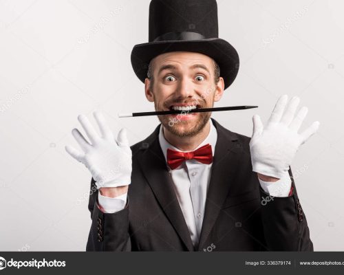 depositphotos_336379174-stock-photo-excited-magician-suit-hat-holding